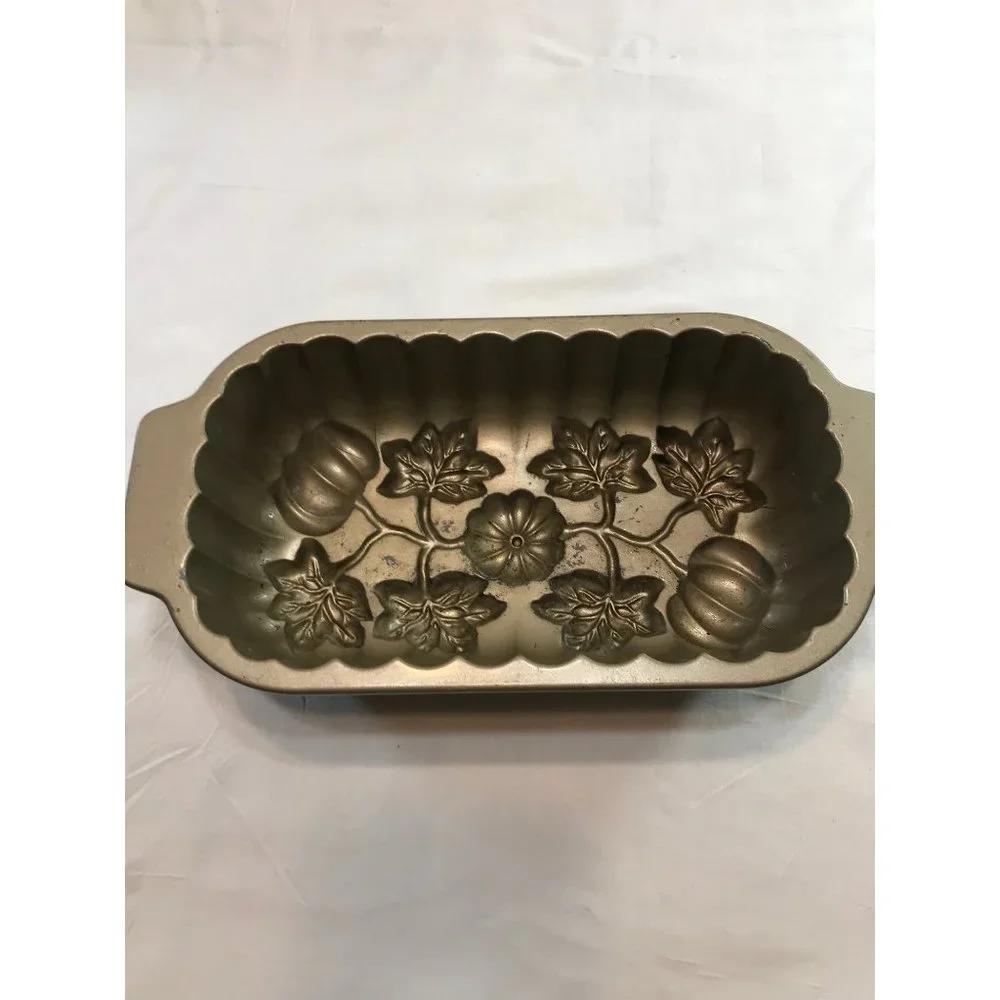 Nordic Ware 13”x61:2” cast aluminum pumpkin patch loaf pan. Made U.S.A.